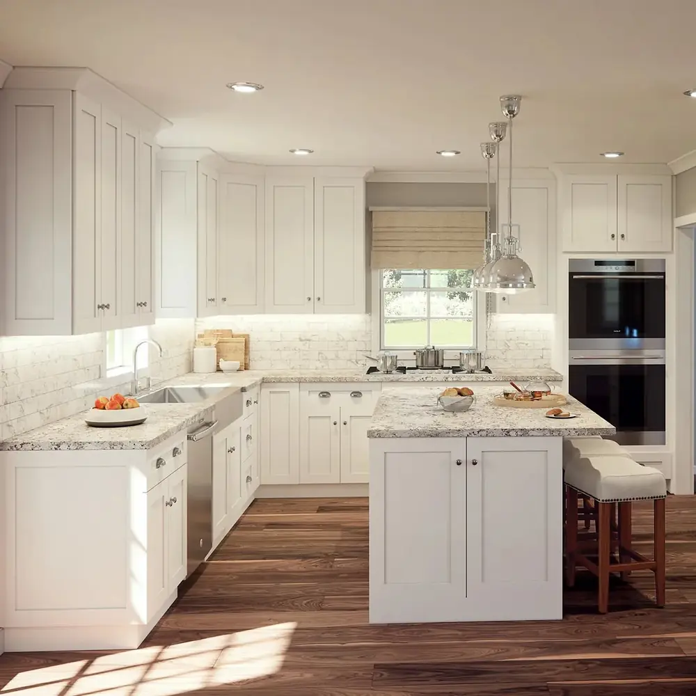 White shaker kitchen with granite countertops and a peninsula